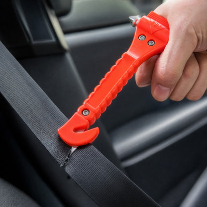 Escape tool's hooked blade cutting through a seatbelt strap