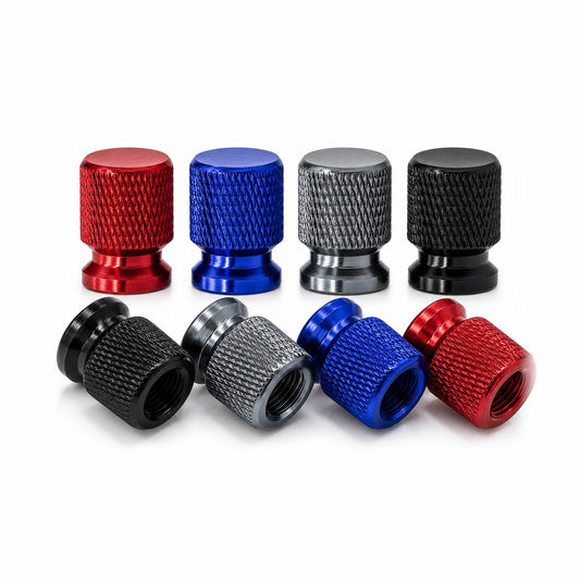 Eight anodised aluminium tyre valve caps in red, blue, grey and black on a white background