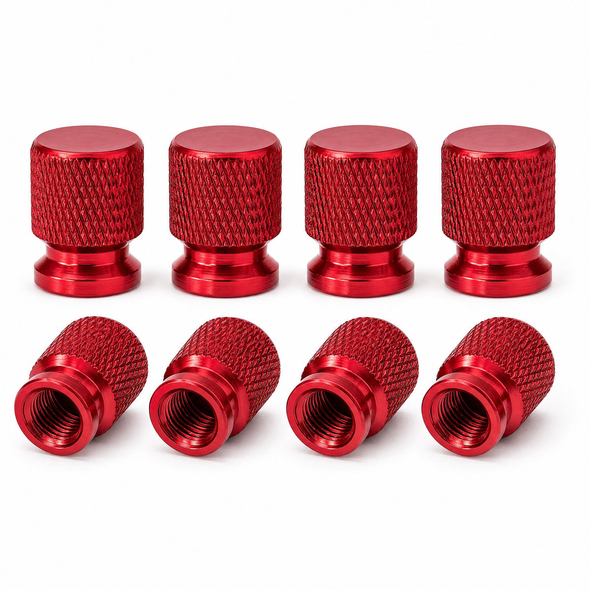 Pack of eight red anodised aluminium tyre valve caps with diamond knurled grip