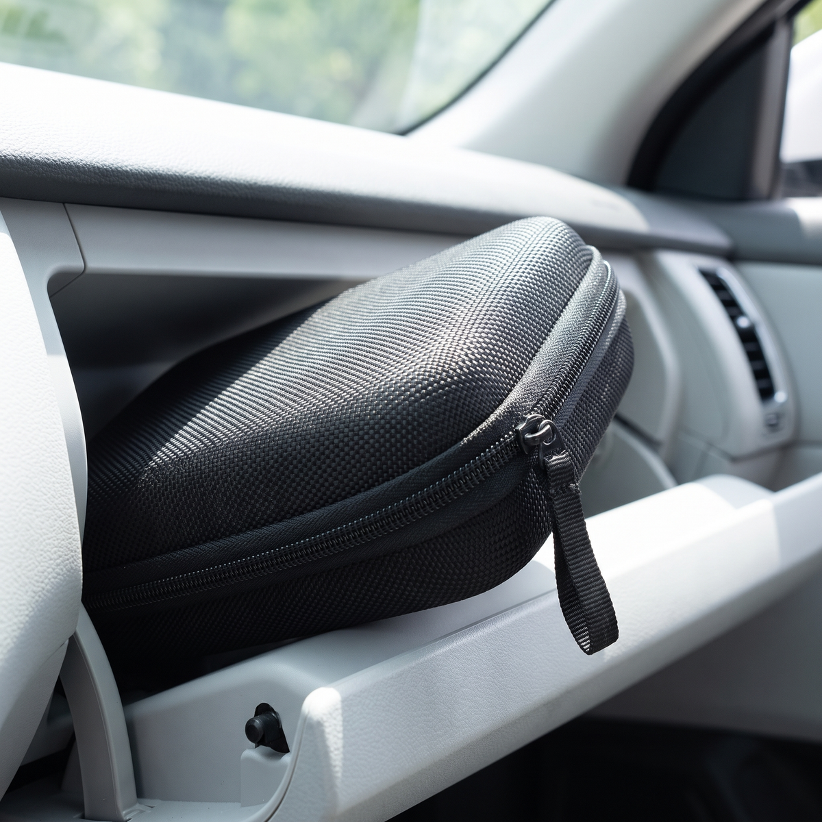 Carry case stored in an open car glovebox